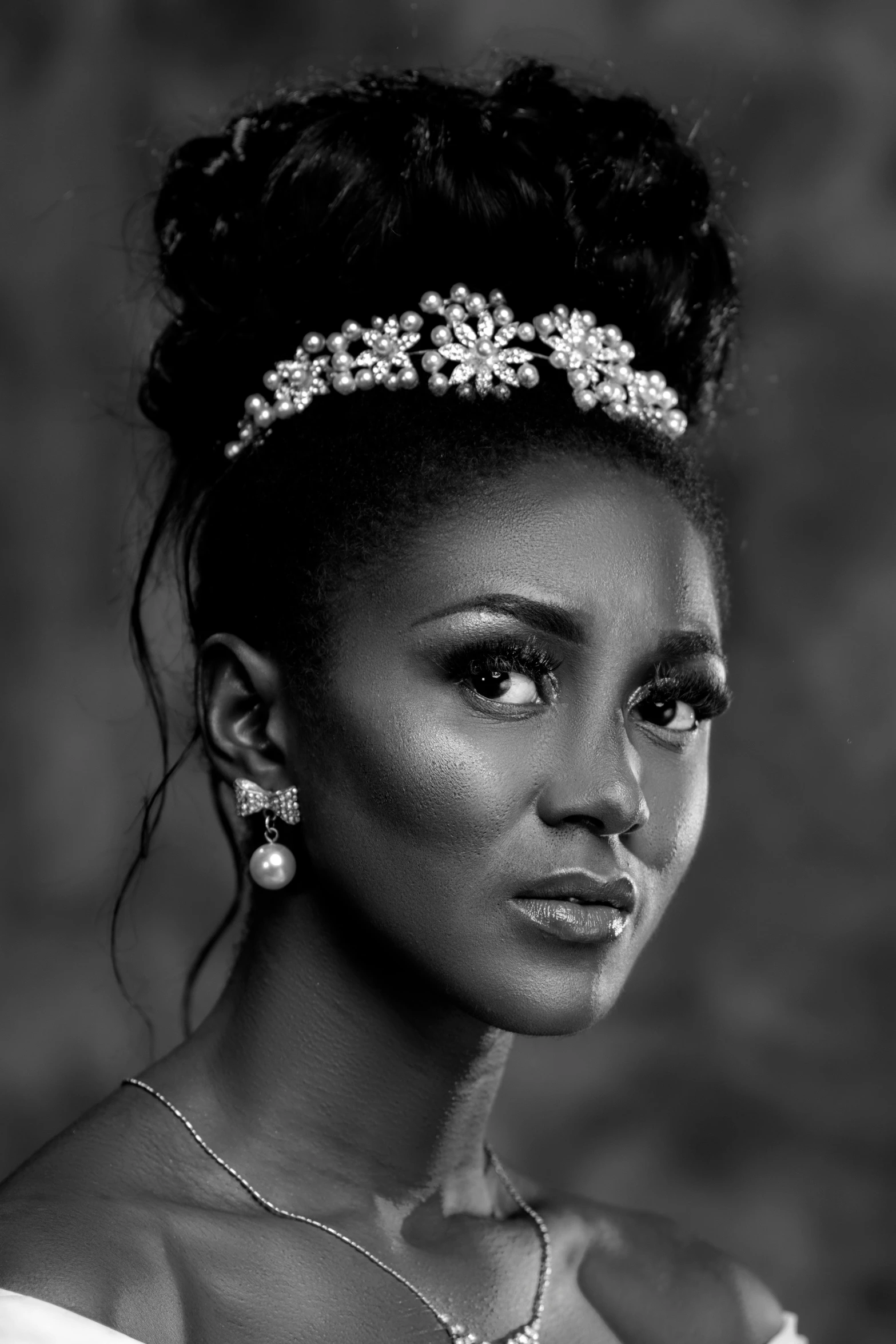 a black and white photo of a woman in a wedding dress, a black and white photo, inspired by Chinwe Chukwuogo-Roy, wearing a tiara, serious business, square, forehead jewelry