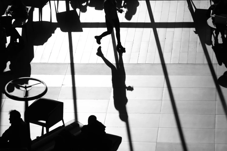 a black and white photo of people in a lobby, by Matthias Weischer, pexels contest winner, big shadows, black. airports, hot summer sun, thumbnail