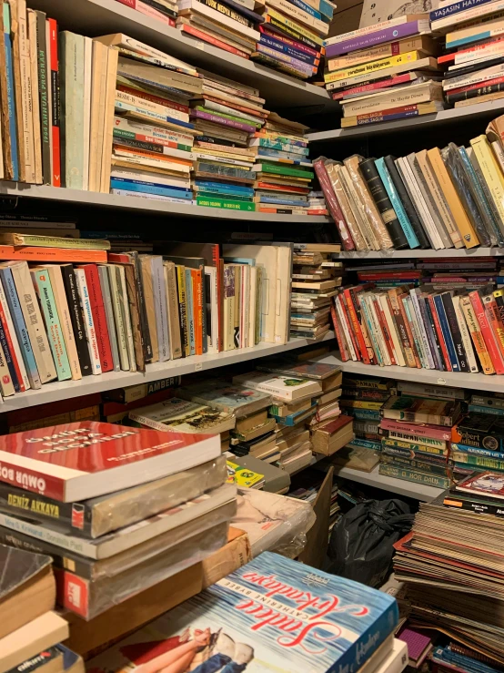 a room filled with lots of books and bookshelves, an album cover, auction catalogue photo, inspect in inventory image, lgbtq, snapchat photo