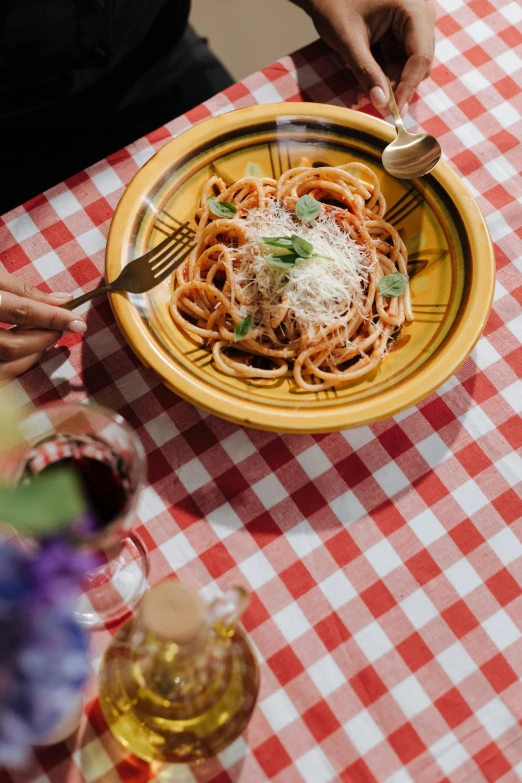 a plate that has a fork and some kind of pasta on it