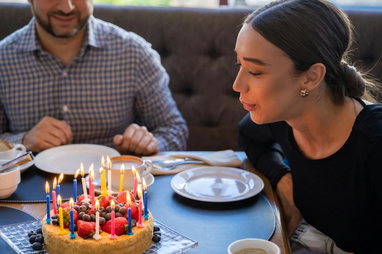 a woman blowing out candles on a birthday cake, pexels contest winner, hyperrealism, having an awkward dinner date, background image, 30 year old man, natural morning light