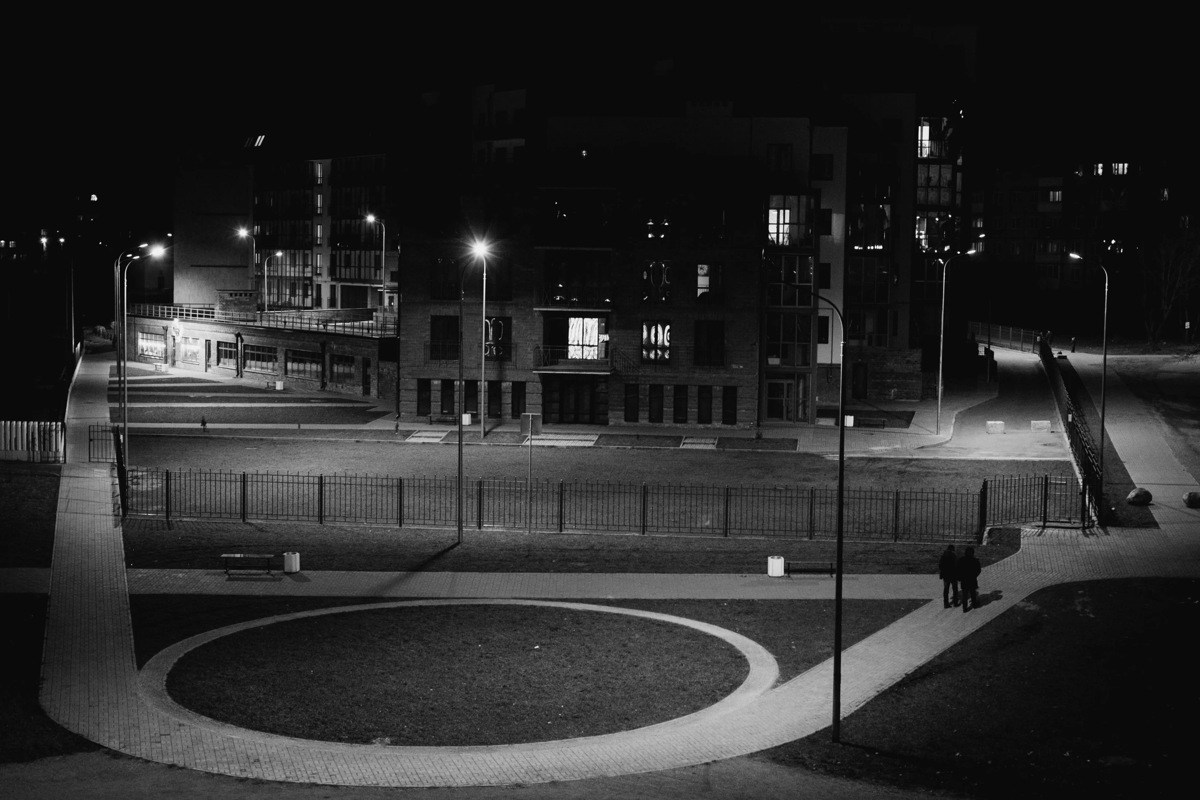 black and white image of buildings at night