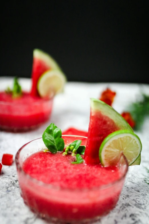 two glasses of watermelon and a lime garnish garnish garnish garnish garnish garnish ga, a portrait, by Julia Pishtar, pexels, snow, made of glazed, slush, fan favorite