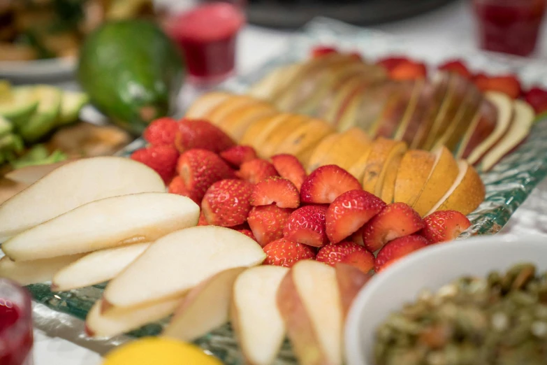 a close up of a plate of fruit on a table, profile image