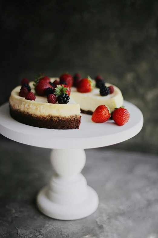 a cake sitting on top of a white cake plate, unsplash, flan, cheeses, 15081959 21121991 01012000 4k, bright rim light