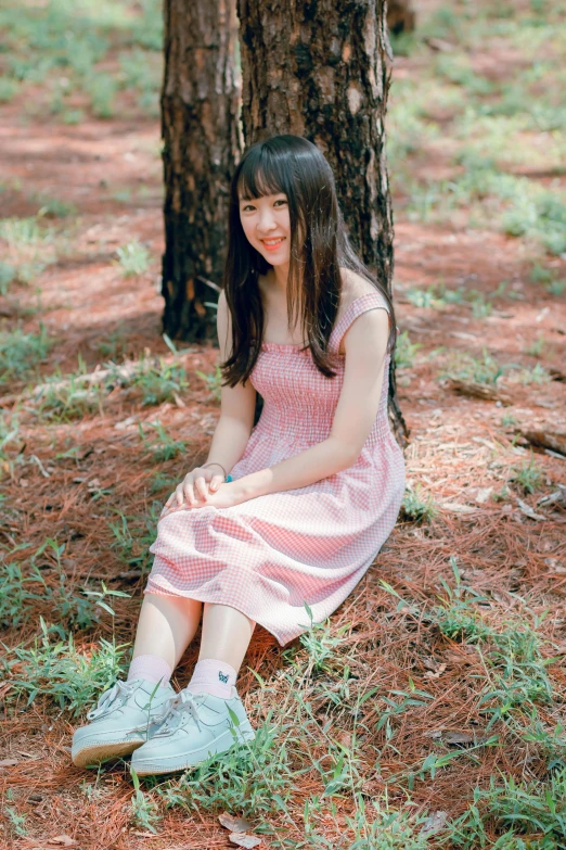 a woman sitting on the ground next to a tree, a picture, wearing a pink dress, lalisa manobal, profile image, large)}]