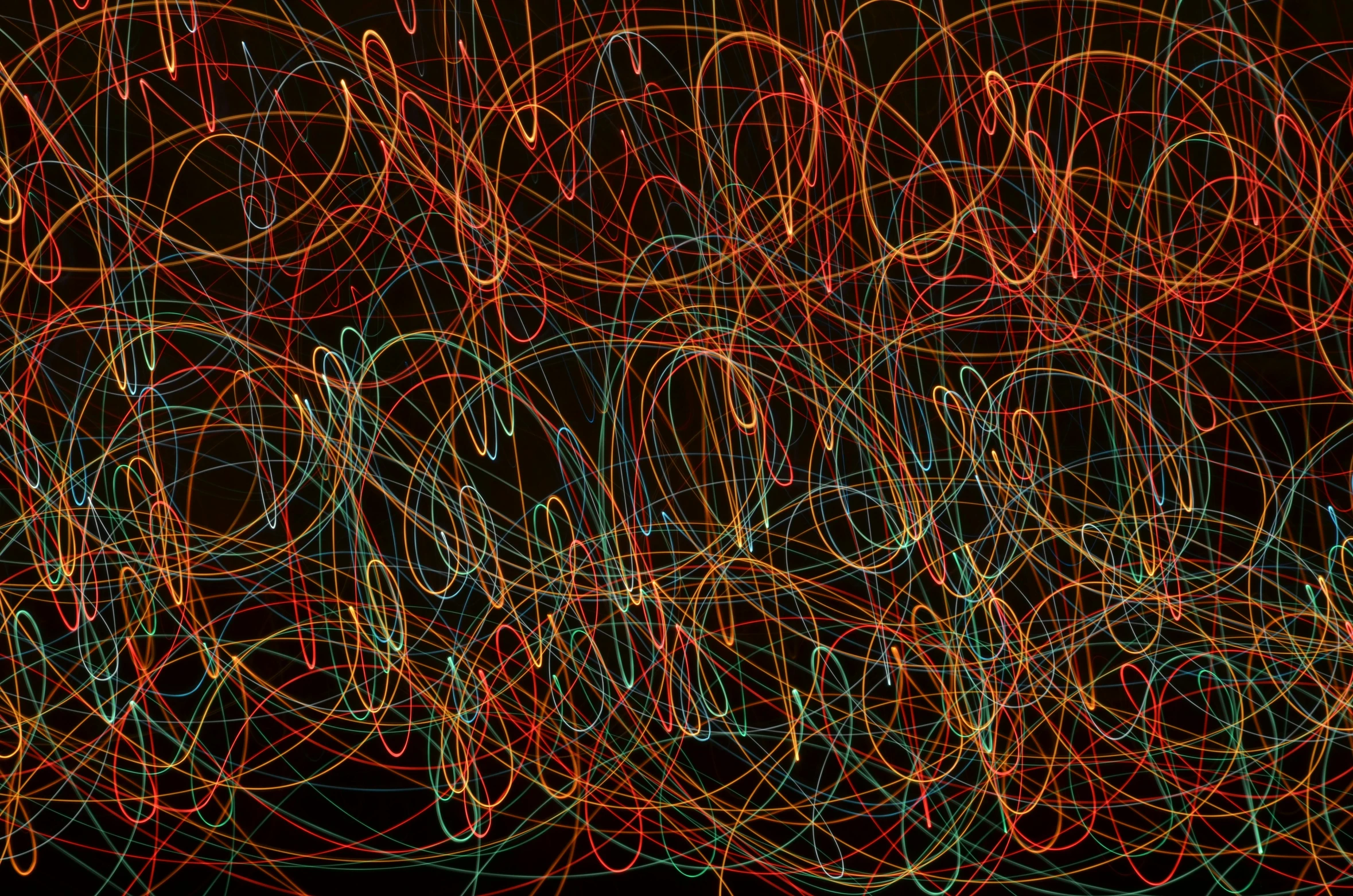 a group of multicolored lights on a black background, an abstract drawing, inspired by Lorentz Frölich, action painting, thick looping wires, coherent photo