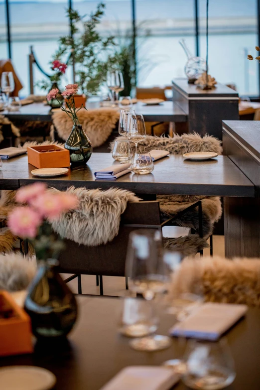 a table is set with glasses and vases