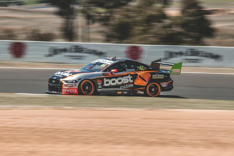 a man driving a racing car down a track