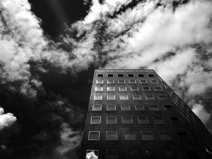 the view from below of a tall building