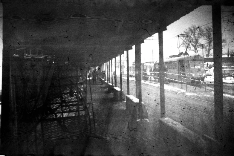 a black and white photo of a train station, realism, scratches and burns on film, pinhole camera, albuquerque, 1862