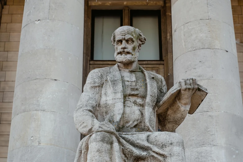 a statue of a man holding a book, by Theophanes the Greek, pexels contest winner, gray beard, entrance, seated, chemistry