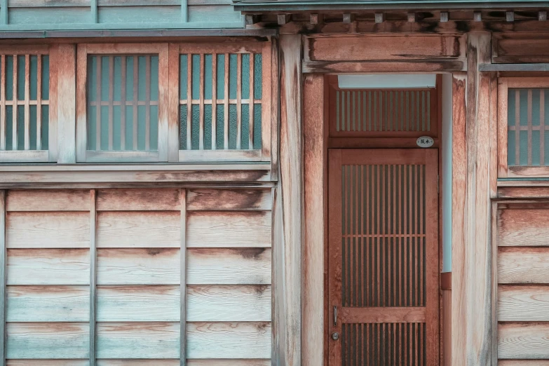 an old building with many windows and wood