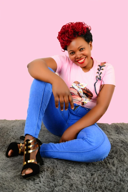 a young woman sitting on the floor wearing high heels