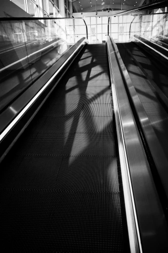 an empty escalator in a building with an escalator