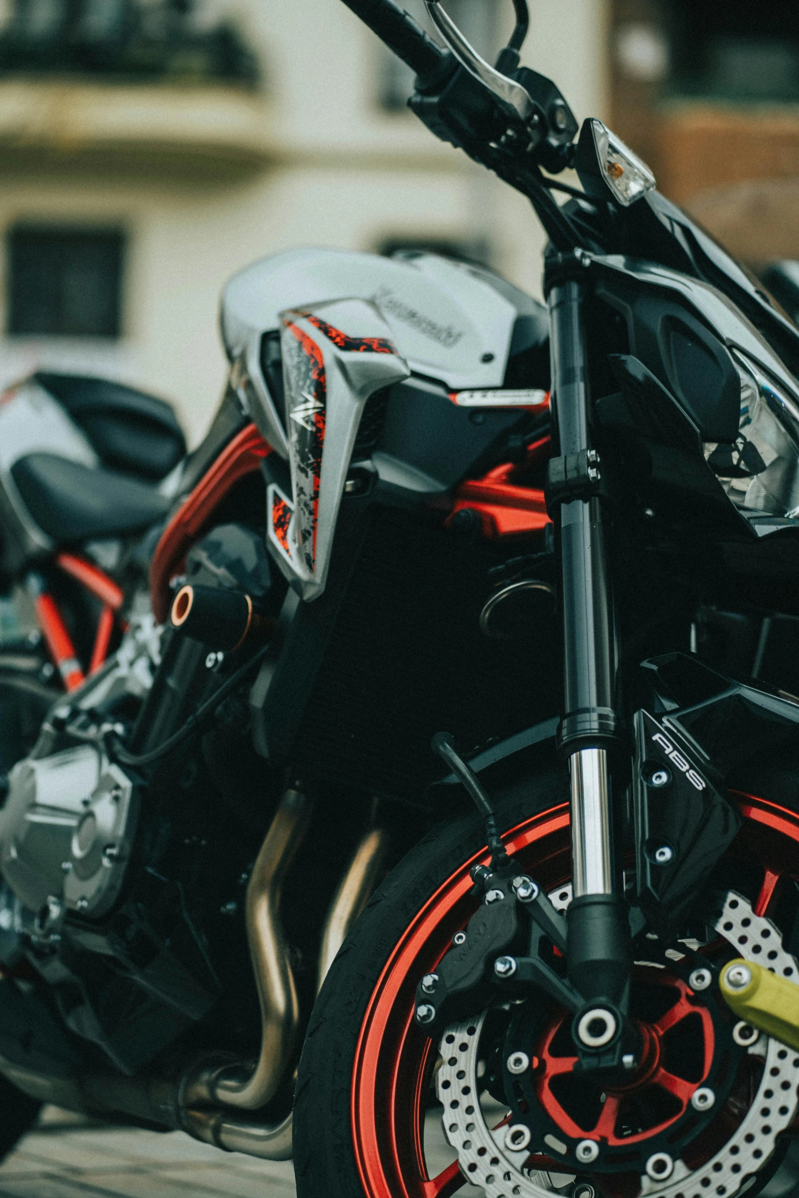 a couple of motorcycles parked next to each other, pexels contest winner, orange racing stripes, close - up profile, diablo, silver white gold red details