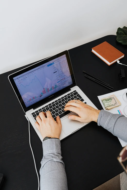 a woman sitting at a desk using a laptop computer, trending on unsplash, pixel art, car trading game, low quality photo, thumbnail, multiple stories