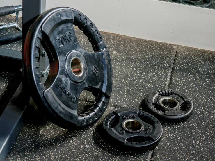 a close up of a gym equipment on a floor, dau-al-set, pan and plates, anon 5 0 mm, profile image, the mighty donut