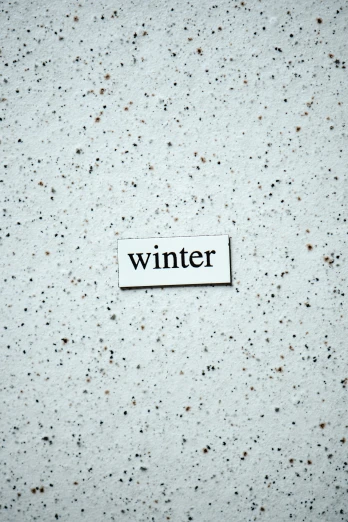 a piece of paper with the word winter on it, pexels contest winner, white concrete, avatar image, terrazzo, single