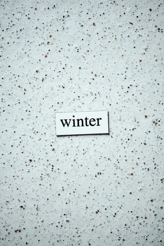 a piece of paper with the word winter on it, pexels contest winner, white concrete, avatar image, terrazzo, single