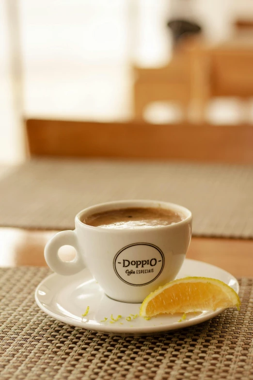 a cup of coffee sitting on top of a saucer, inspired by Géza Dósa, dribble, lemon, deroo, larapi, premium