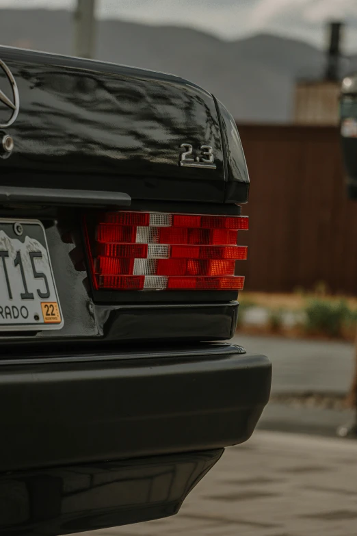 the back of a black mercedes benz benz benz benz benz benz benz benz benz benz benz benz, by Sven Erixson, unsplash, vhs static overlay, early morning, 8k 50mm iso 10, bay area