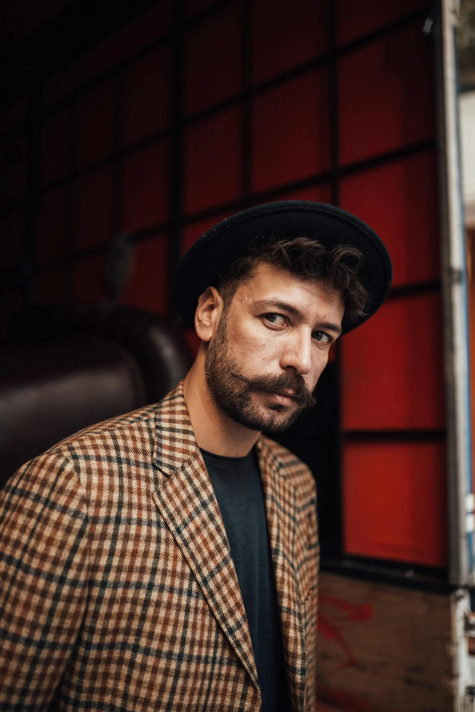 a close up of a person wearing a hat, an album cover, inspired by Germán Londoño, pexels, handsome man, hipster dad, mark edward fischbach, portrait pose