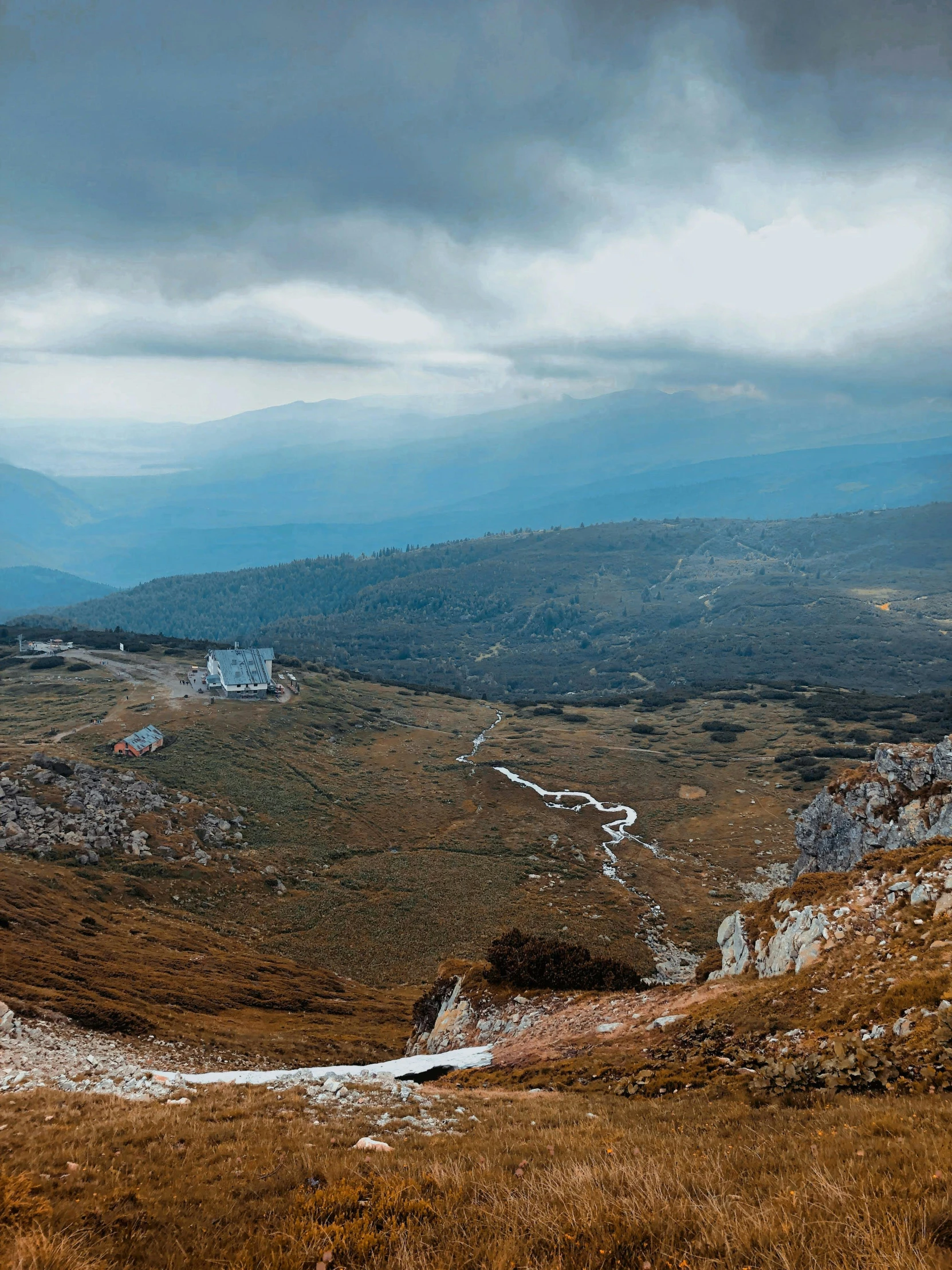 a large open area that is being viewed over a hill