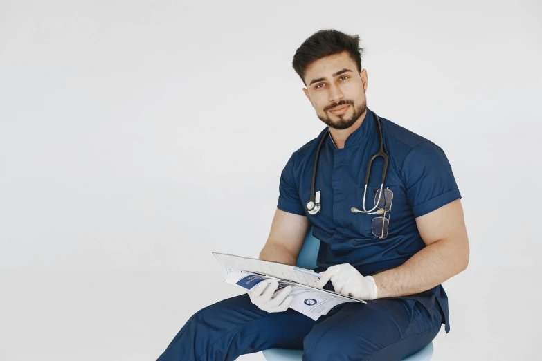 a man in a doctor's outfit sitting on a chair