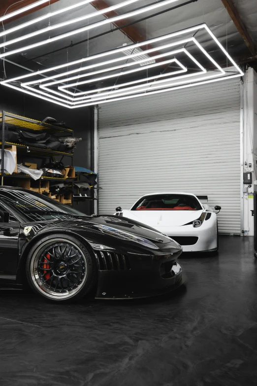 a black sports car parked in a garage, inspired by Bernardo Cavallino, pexels contest winner, renaissance, light source on left, bay area, laquer and steel, replicas