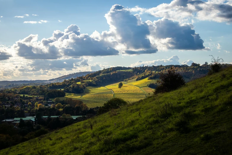 a view of some rolling hills near the town