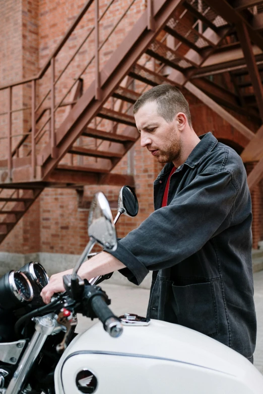 a man standing next to a white motorcycle, inspired by Dan Christensen, unsplash, holding a wrench, lachlan bailey, plating, profile image