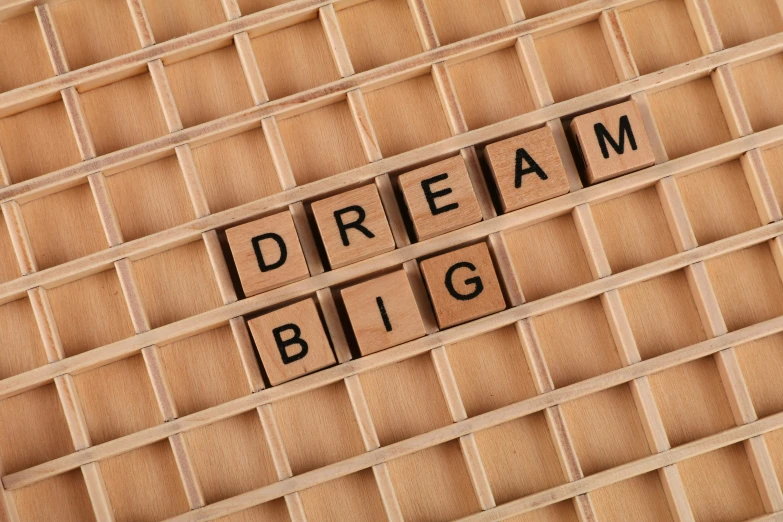 a wooden sign that says dream big on it, by Joe Bowler, trending on pixabay, a rubik's cube, beige, sleep, 15081959 21121991 01012000 4k