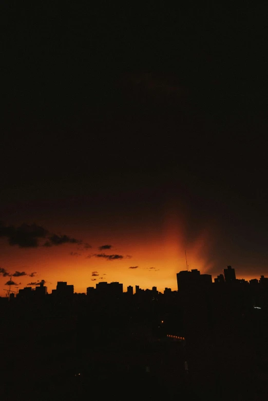 the sun is setting over the city skyline, a picture, by Alexis Grimou, happening, dark tone, in sao paulo, sky is orangish outside, lightshow