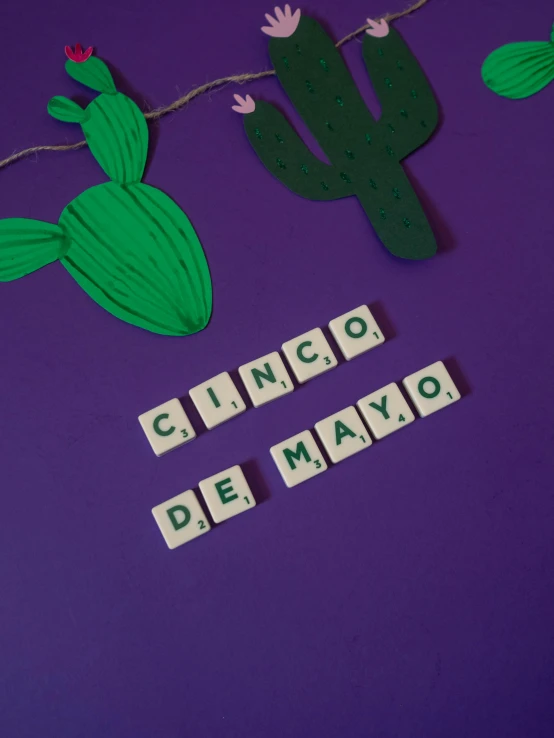 a sign that says cinco de mayo on a purple background, pexels contest winner, cubes on table, in claymation, elena masci, avatar image