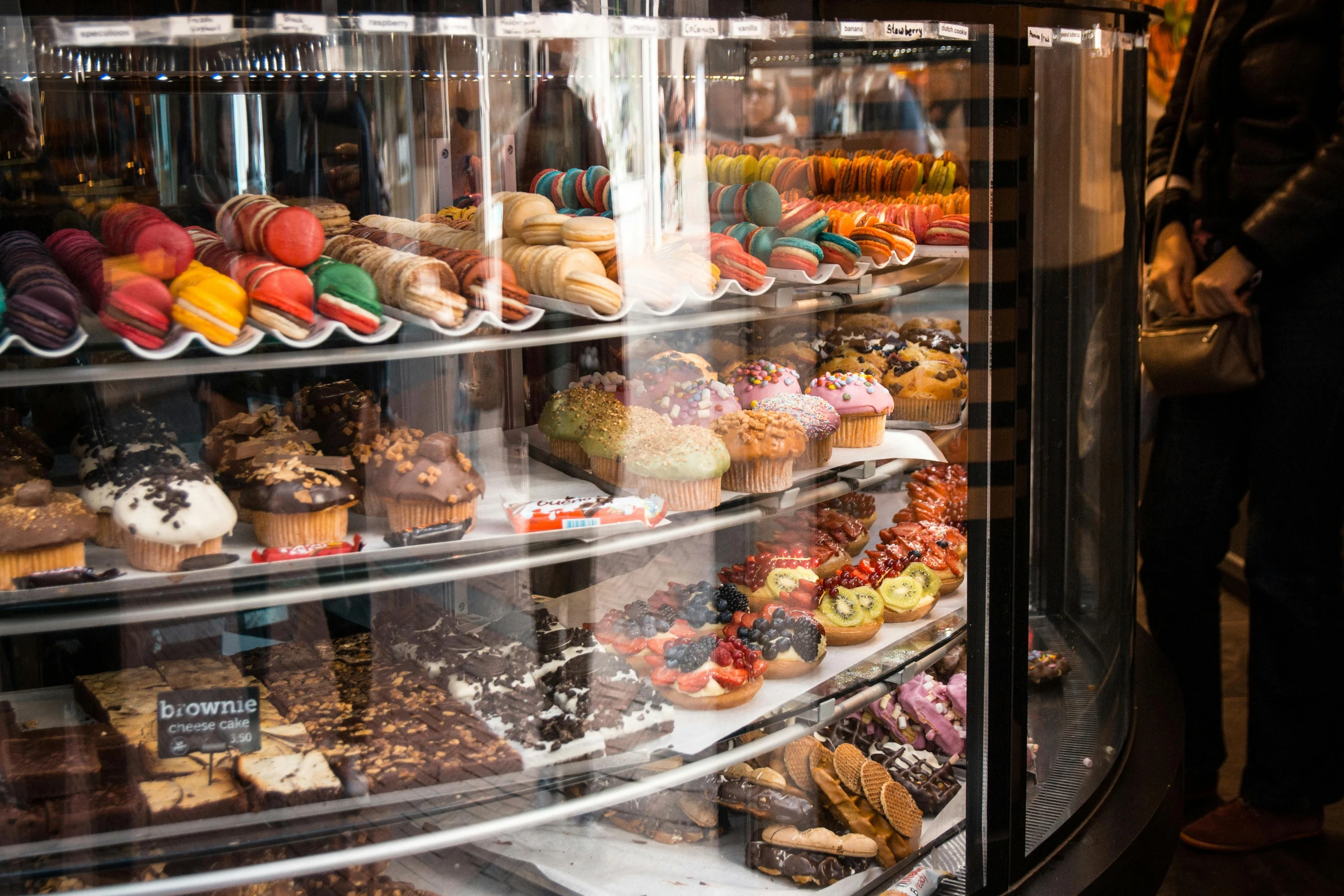 a display case filled with lots of different types of pastries