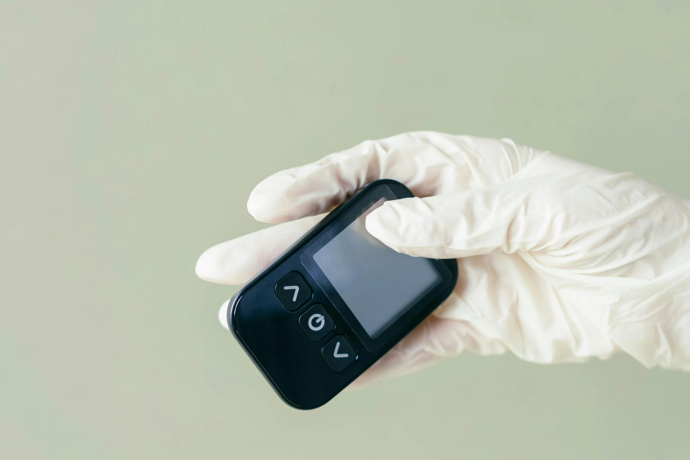 a person in white gloves holding a cell phone, a picture, medical equipment, avatar image, miniaturecore, aesthetics