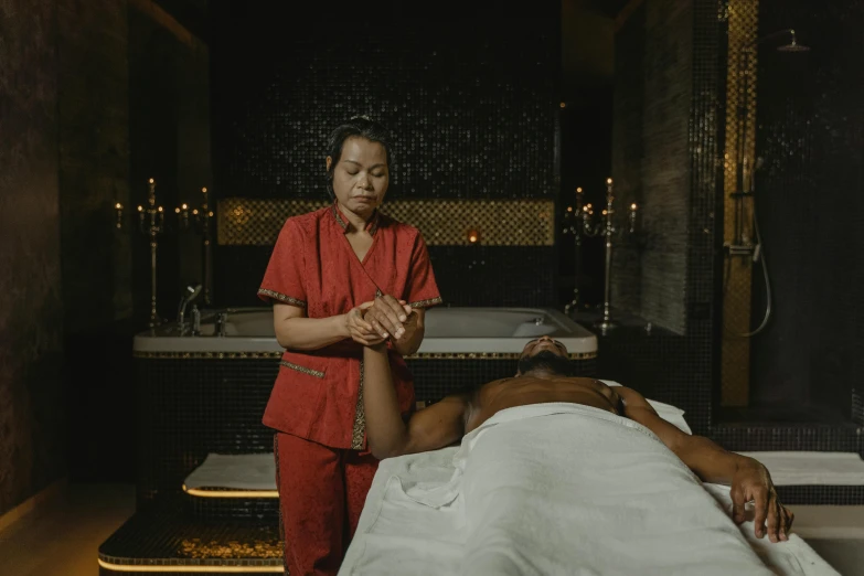 a woman getting a massage at a spa, pexels contest winner, man is with black skin, full body 8k, asian male, gif