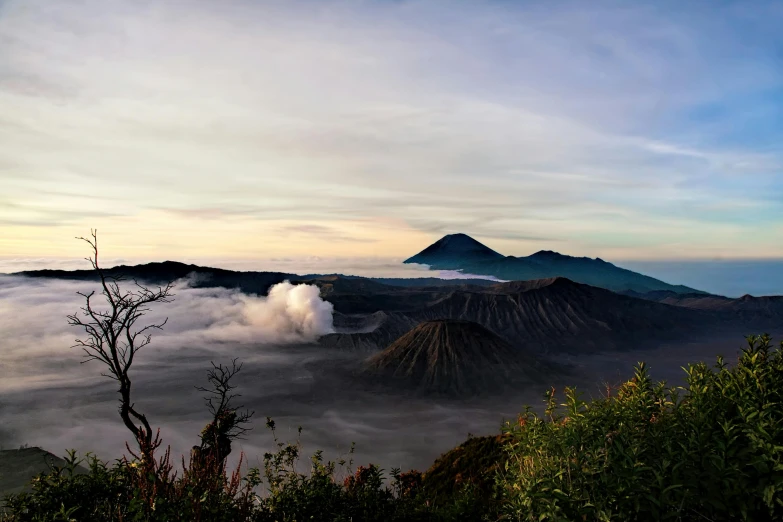 a cloud is flying over the landscape