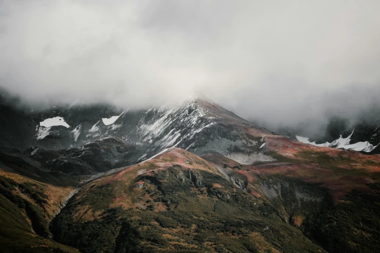 some clouds and a mountain in the distance