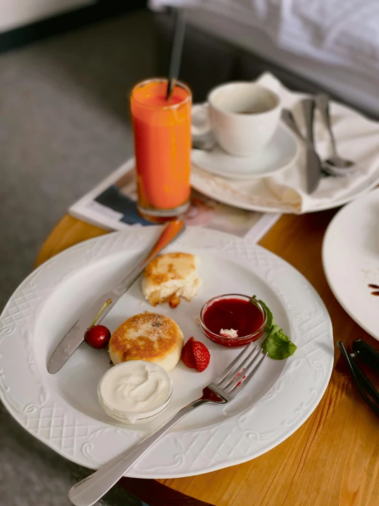 plate with food next to orange juice and a drink