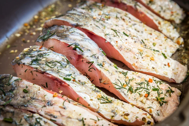 a close up of some fish in a pan, by Micha Klein, cut-away, nordic, profile image, ham