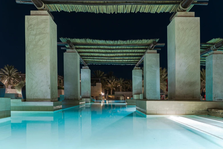 the blue pool is under an open canopy