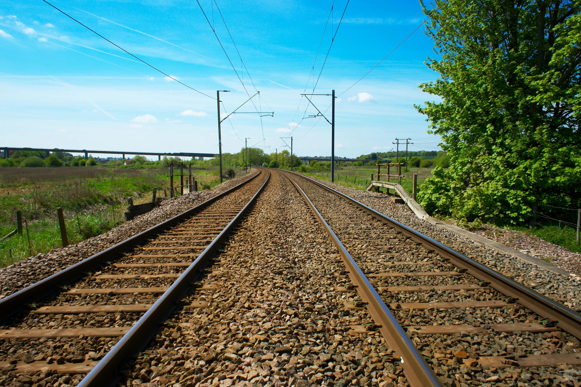 a couple of train tracks that are next to each other, an album cover, unsplash, regionalism, northern france, blue sky, getty images, thumbnail