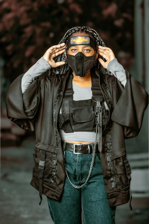 woman wearing black mask while she's covering her eyes