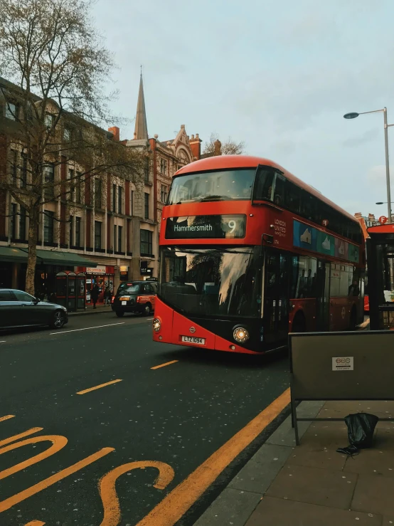 a red double decker bus driving down a street, a picture, 🚿🗝📝, 4 k image