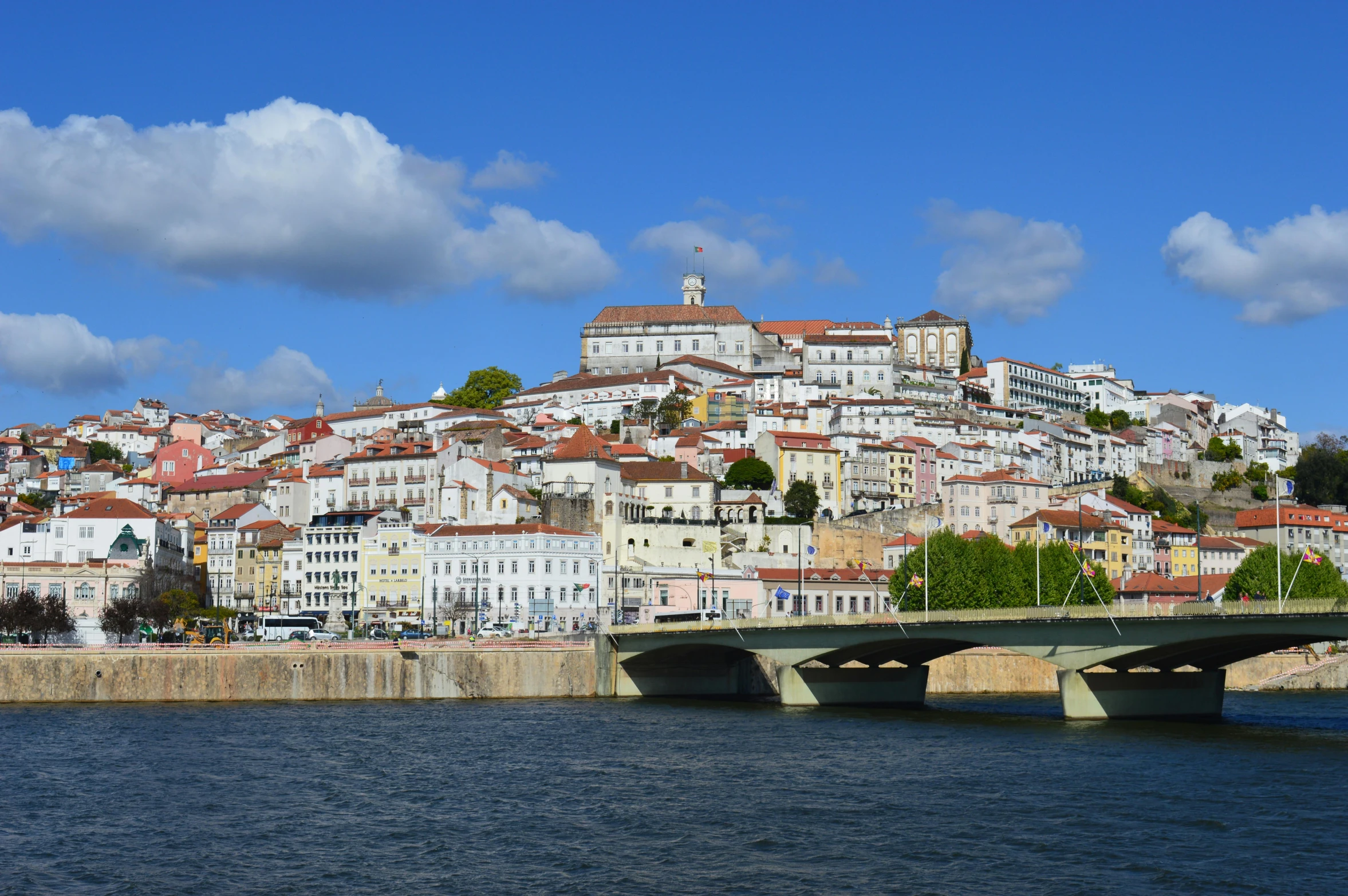 a bridge over a body of water with a city in the background, by Tom Wänerstrand, pexels contest winner, renaissance, portugal, white houses, herzog de meuron, slide show