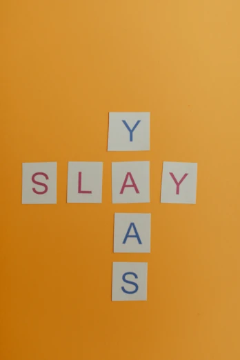 a cross made out of letters sitting on top of a table, an album cover, by Peter Alexander Hay, pixabay, slay, ah yes, board game, belaying
