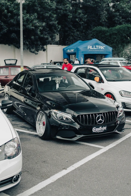 a group of mercedes cars sitting in a parking lot