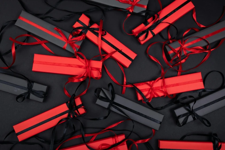 a bunch of dynamites laying on top of each other, by Julia Pishtar, pexels contest winner, black and red color scheme, birthday wrapped presents, obi strip, all black matte product